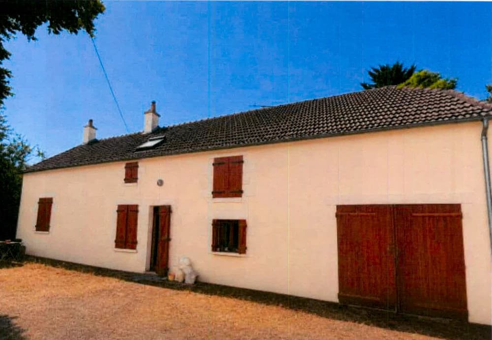 Ravalement complet d’une longère et de sa grange — La façade sur cour, du corps de logis à la grange, après travaux
